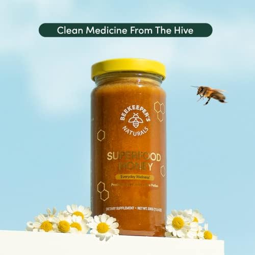 Authentic BeeKeeper's Naturals bee pollen and royal jelly dietary supplement jar isolated on a clean background.