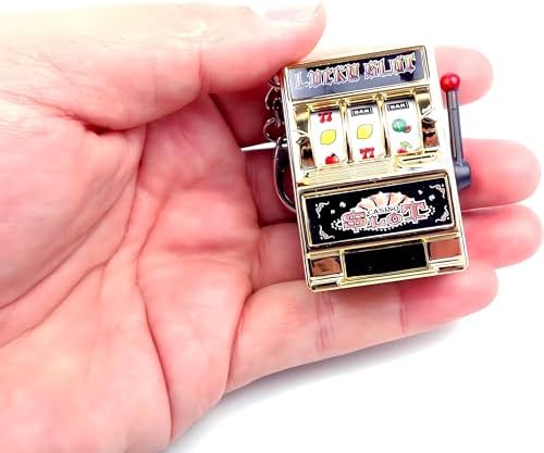 MAGIKON lucky slot machine keychain attached to a bag showcasing its portable lightweight design.
