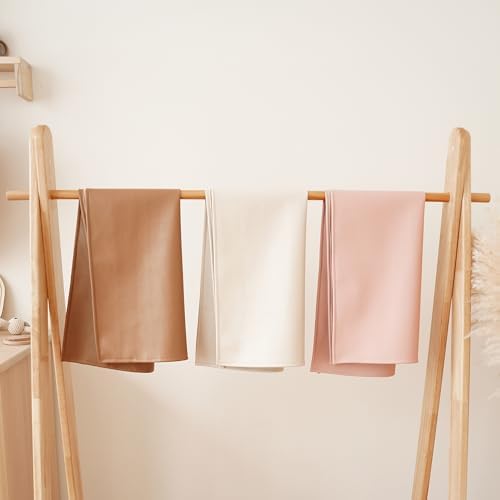 Konssy baby changing pad showing waterproof surface properties