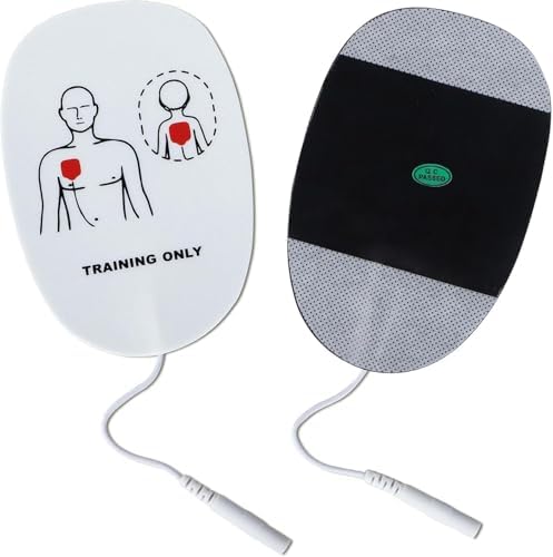Five pairs of white and green XFT AED practice pads spread out.