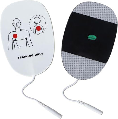 Five pairs of white and green XFT AED practice pads spread out.