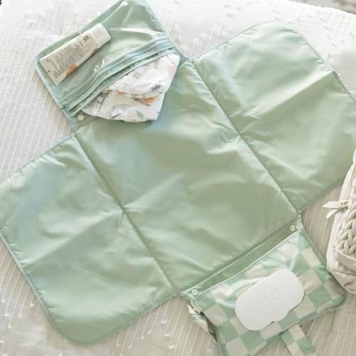 Tiny Twinkle foldable diaper pad storage compartments organized with diapers and baby creams.