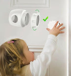 Adult hand demonstrating how to squeeze and operate the universal fit baby safety door guard