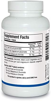 Side view of Biotics Research Bio CMP bottle displaying detailed supplement facts including calcium, magnesium, and potassium dosages.