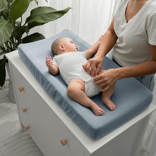 Secure elastic edging detail of the Comfy Cubs universal baby changing pad mattress cover.