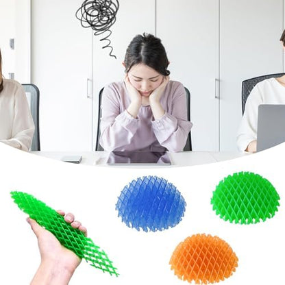 Seven Seas squishy desk toy compressed into a compact shape on a clean white surface.