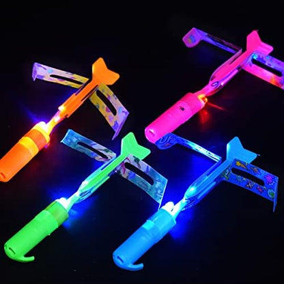 The JX rocket slingshot flying high into the night sky leaving a bright luminous trail.