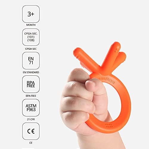 Orange Comotomo teething toy being held by small hands for motor skills