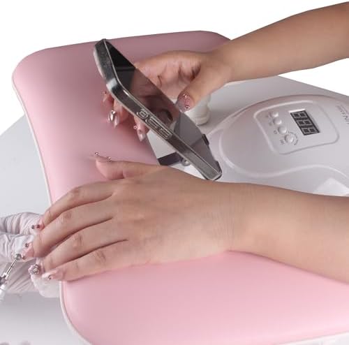Adjustable height legs on pink manicure hand rest
