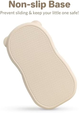 The non-slip textured bottom base of the Knirose baby diaper changing pad displayed clearly.
