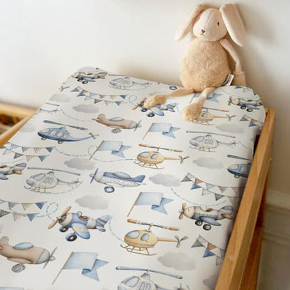 Soft blue nursery changing table sheet with aircraft pattern