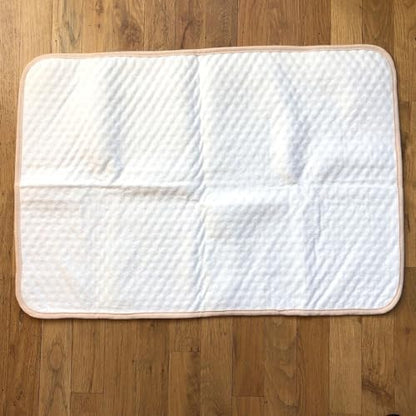 Folded Tiny Undies waterproof changing mat for travel portability