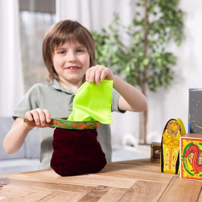 Close up of the step by step illustrated instruction manual included with the deluxe magician props kit