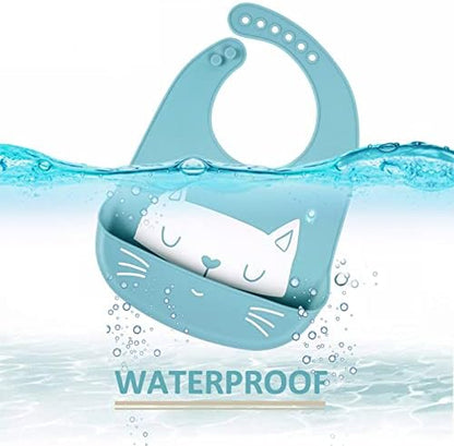 Three assorted colors of YINGJEE waterproof silicone weaning aprons for infants laid flat.