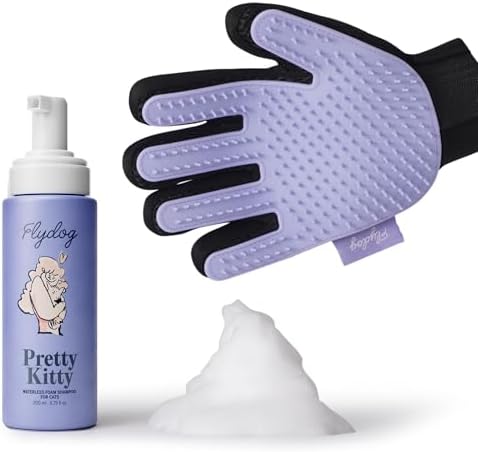 No-rinse pet dry shampoo foam being applied with purple silicone glove on cat fur.