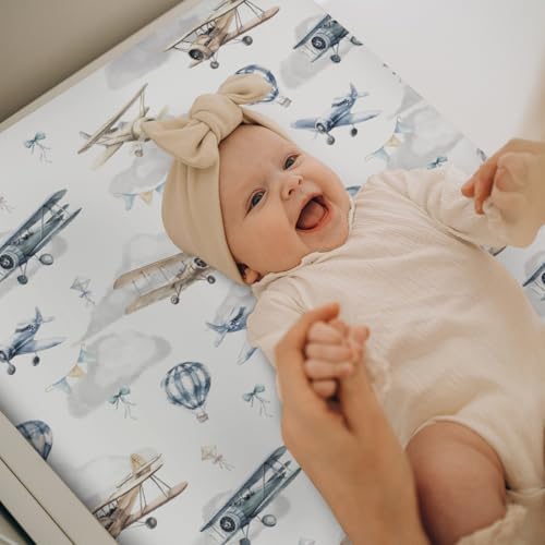 Baby changing table with vintage airplane theme mat cover