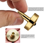 Top down view of the brass fidget toy on a workspace surface