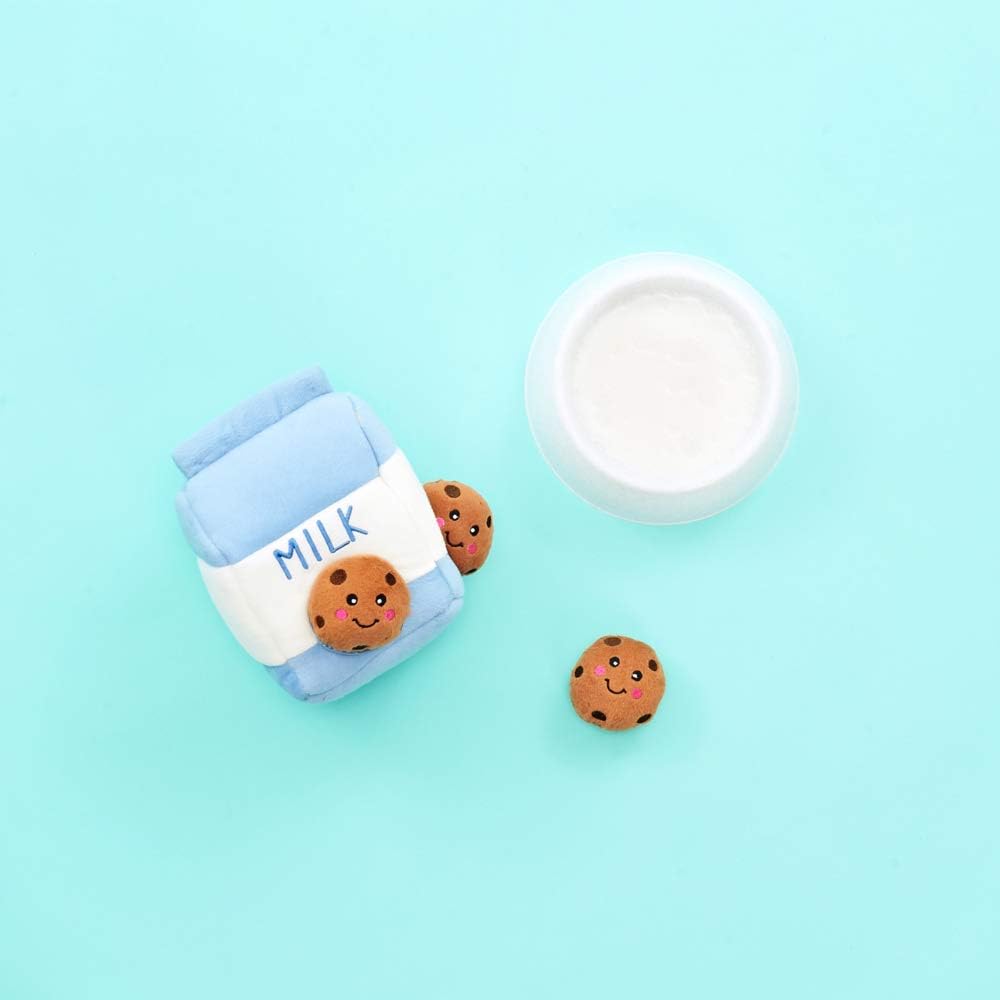 ZippyPaws Milk and Cookies pet enrichment plush puzzle demonstrating how to insert squeaky toys.