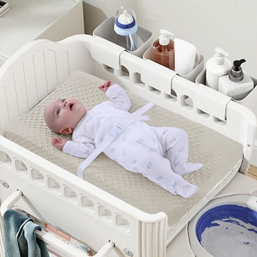 Nivava Baby changing pad cover elastic bottom and safety strap cutouts.