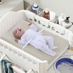Nivava Baby changing pad cover elastic bottom and safety strap cutouts.