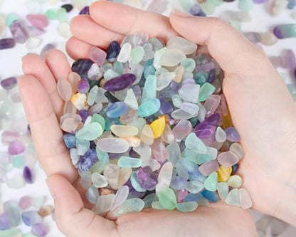 Close up shot showing the natural purple and green texture of Qinjiejie fluorite chips.
