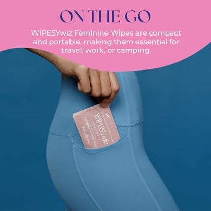 Compact travel size feminine hygiene wipes being placed into a small handbag.