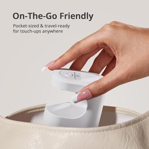White pocket sized BTArtboxnails lamp being used for quick sixty second gel polish curing.