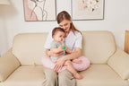 Pink nursing pillow displayed for mom and baby comfort