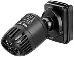 Submersible aquarium wave pump attached to fish tank glass with magnetic mount
