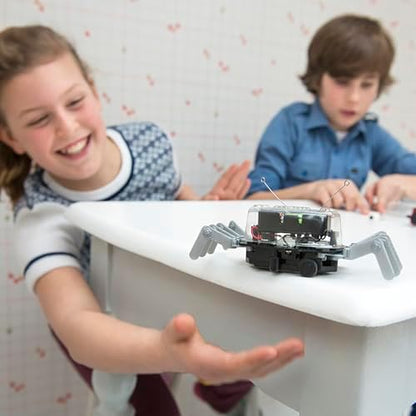 Kids playing with 4M 5576 Table Top Robot engineering toy