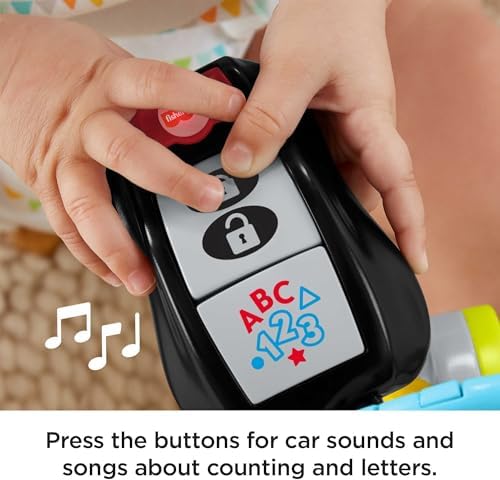 Fisher-Price educational toddler keys being held to demonstrate the portable travel size.