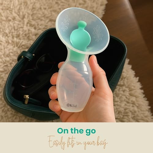 Klid Home manual breast pump attached to a flat surface via its sturdy suction base