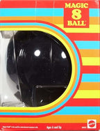Magic 8 Ball toy held in hand for scale