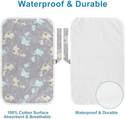 Foldable diaper changing pad attached securely to a stroller handle during an outing