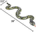 Three pieces of thirty nine inch blow up snakes arranged on grass as garden reptile decor