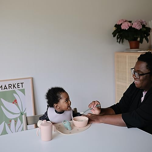 Mushie premium toddler spoons showcasing ergonomic handles designed for secure self-feeding grip.