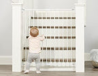 Regalo hardware mounted walk through safety gate protecting top of stairs area