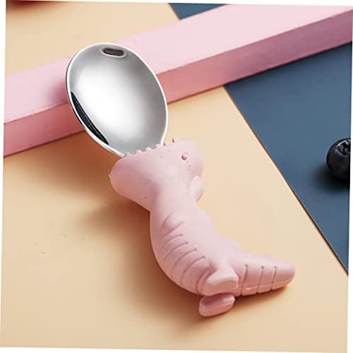 Pink silicone dinosaur handles on toddler stainless steel cutlery set close up