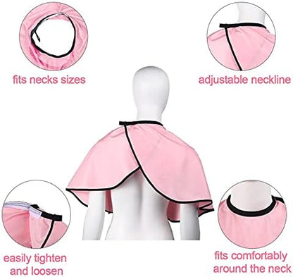 Short makeup artist cape shielding a model shoulders during a cosmetic session.