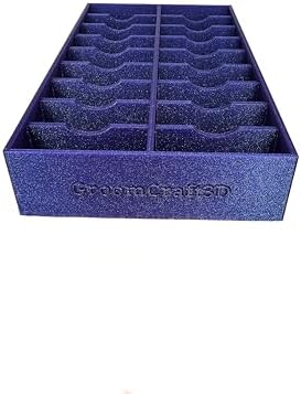 Textured 3D-printed plastic blade holder holding eighteen standard and wide detachable clipper blades