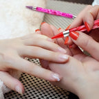 Tatuo four piece dual ended nail gemstone applicator kit laid out flat showing red purple and blue marbled designs.