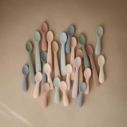Side angle view highlighting the durable internal structure and compact size of Mushie starter utensils