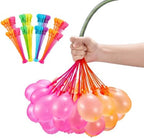 Bright multi colored tropical theme water balloons resting inside a water filled bucket prepared for outdoor play.