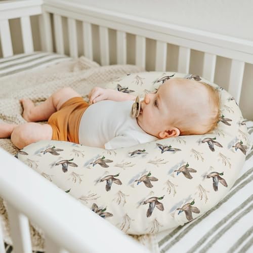 Nursing pillow cover shown on a standard U-shaped feeding pillow