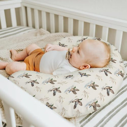 Nursing pillow cover shown on a standard U-shaped feeding pillow