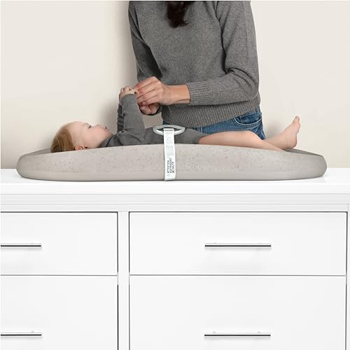 Delta Children grey changing pad showing contoured design and heart detail