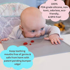 The Table Tyke baby activity mat rolled up tightly with integrated loops secured for travel convenience