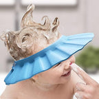 Child wearing waterproof blue bath visor in bathroom