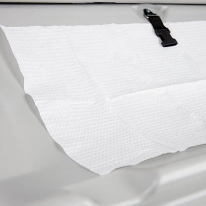 Weavura disposable liner placed on commercial changing table