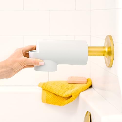 Flexible silicone material of the Munchkin safety cover being adjusted for installation.